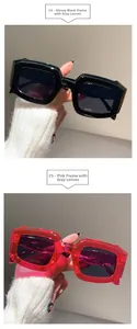 Detail view of thick rectangle sunglasses in glossy black and transparent pink frames