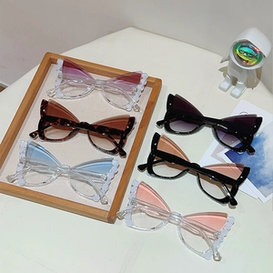 Cat eye butterfly sunglasses with pearl frame and tinted lenses in multiple colors
