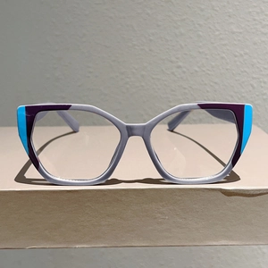 Detailed view of cat-eye frames with stylish grey, purple, and blue color-blocking design