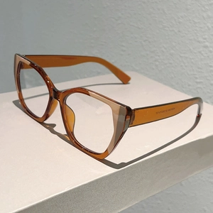 Cat eye blue light blocking glasses with amber frames and stylish minimalist design
