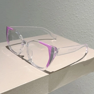 Macro shot of transparent polygon frame glasses with purple accents and temple specs