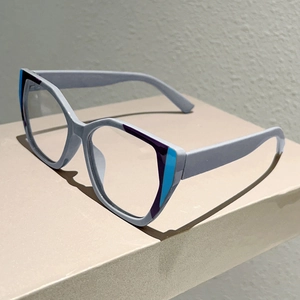 Macro detail of cat-eye glasses frame featuring purple and blue contrast spliced design