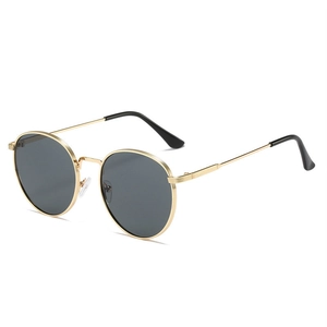 Retro round sunglasses with slim gold metal frames and dark gray lenses for men and women