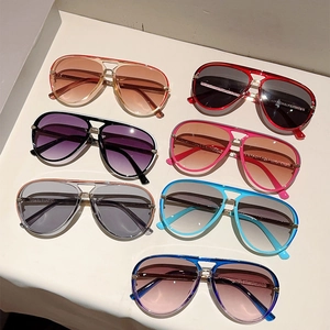 Top view of seven colorful aviator sunglasses with gradient lenses and double bridge design