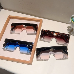 Detail of rimless square sunglasses with gradient lenses and sparkling rhinestone accents