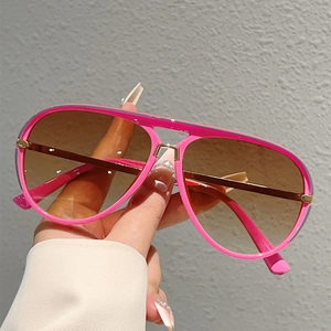 Macro detail of pink aviator frame with double bridge design and gradient lenses