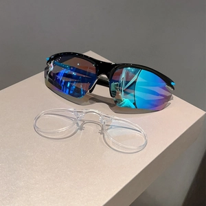 Detail showing sports sunglasses with blue mirrored lenses and a clear inner myopic frame insert