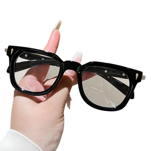Women's cat-eye anti-blue light glasses with black resin frames and gold metal accents