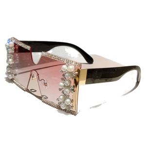 Frameless square sunglasses with pink gradient lenses, pearl accents and rhinestones