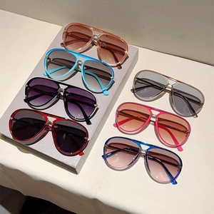 Multiple stylish retro aviator sunglasses in various gradient lens colors and light frames