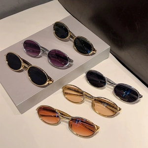 Lunettes de soleil ovales vintage avec monture en métal doré et argenté, verres variés