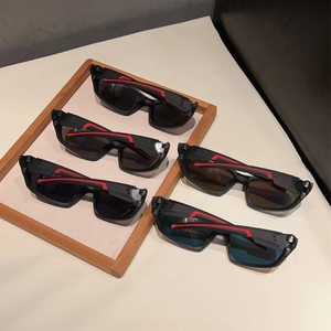 Detail of five sports sunglasses with vibrant mirrored lenses and matte red stripe frames