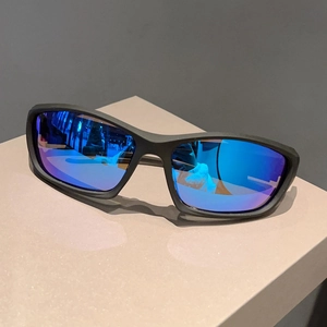 Detail of matte black cycling sunglasses with blue-purple mirrored polarized lenses