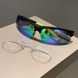 Detail view of semi-rimless cycling sunglasses with polarized lens and myopia inner frame