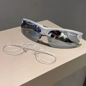 Detail of white sports sunglasses with grey lenses and a clear inner frame for myopia