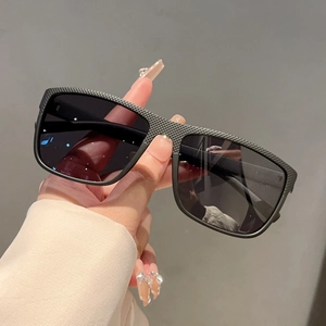 Classic rectangular black sunglasses with textured bridge and dark UV lenses for outdoor use