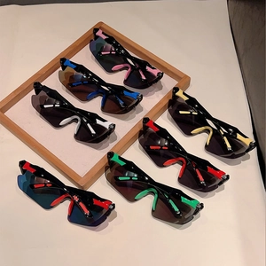 Detailed close-up of colorful sporty sunglasses with dark polarized lenses in a tray