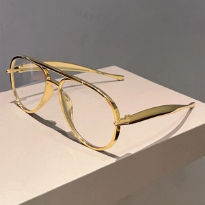 Classic gold aviator eyeglasses with double bridge metal frame on geometric stand