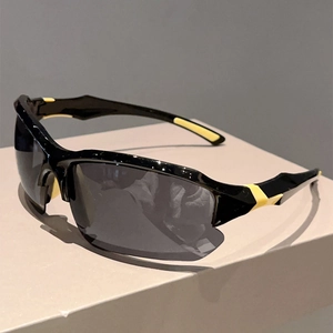 Detail view of streamlined sports sunglasses with black and yellow non-slip frame design