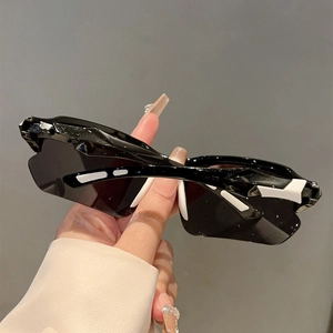 Cool sporty sunglasses with black thick frames and white geometric patterns on the sides