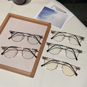 Detailed display of semi-rimless metal eyewear frames in multiple modern color options
