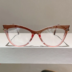 Cat eye blue light blocking glasses with pink and brown gradient frames and metal hinges