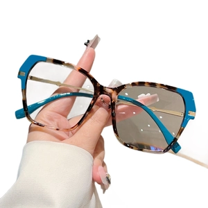Vintage cat eye glasses in tortoiseshell and blue contrast with gold metal temples