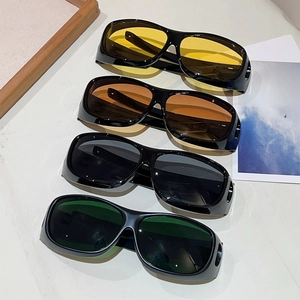 Detailed view of four sporty oversized sunglasses in yellow, amber, gray, and green lenses