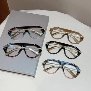 Flat lay of vintage aviator glasses in five colorways including blue, pink, and tortoiseshell