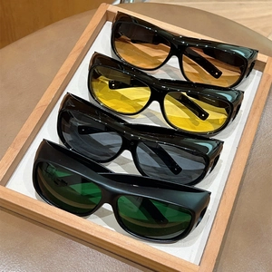 Set of four large frame sports sunglasses with colorful lenses and side protection