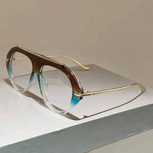 Detail of gradient frames with gold metal temples on vintage aviator anti-blue light glasses
