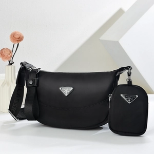 Lightweight black nylon crossbody bag with small coin pouch and adjustable strap