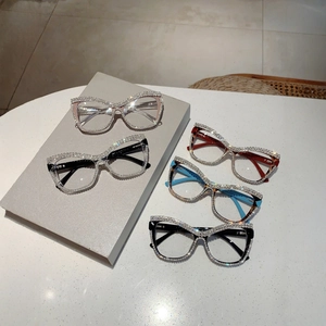 Cat eye glasses frames with rhinestone accents in pink, black, and tortoise shell colors