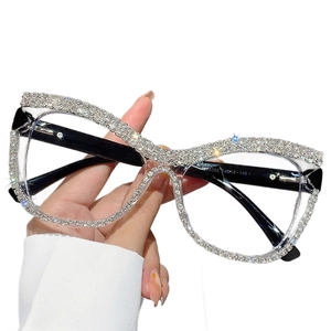 Oversized rhinestone glasses frame with sparkling crystal trim and black temple detail