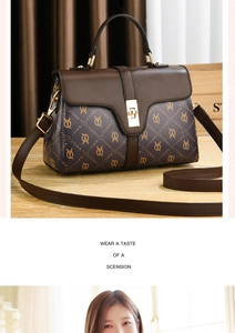 Macro shot of retro Kaili monogram tote bag with brown leather and gold hardware