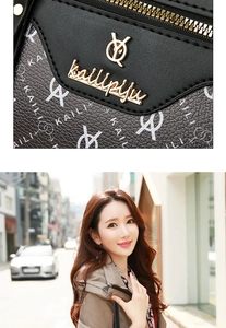 Détail du logo en métal et texture cuir d'un sac à main bicolore gris et noir chic