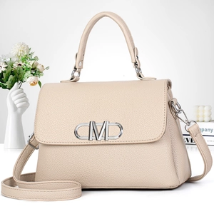Elegant apricot lychee leather handbag with silver logo buckle and crossbody strap