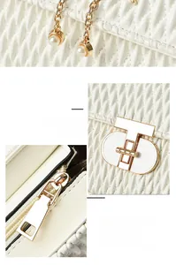 Detail of white quilted handbag showing gold twist lock and pearl chain decoration