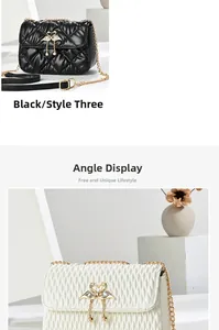 Detail of black and white quilted chain shoulder bags with swan twist lock closures