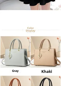 Detail of luxury tote bag colors with heart pendant and adjustable shoulder straps