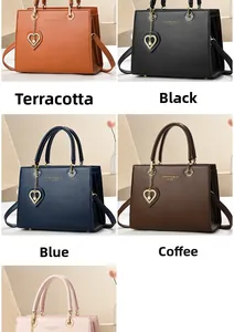 Detail view of stylish tote bags in five colors with gold heart charms and textured leather