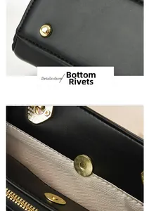Detail of gold bottom rivets and magnetic buckle on black leather tote bag with lining