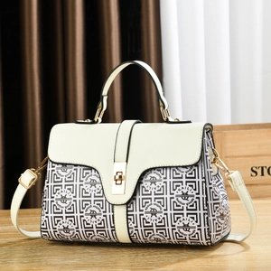 Elegant ivory and plaid handbag with top handle and gold twist lock for women