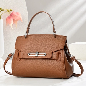 Brown litchi leather crossbody bag with silver buckle and detachable shoulder strap