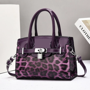 Fashionable purple leopard print handbag with glossy finish and silver metal lock