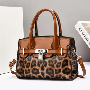 Elegant leopard print patchwork handbag in brown patent leather with metal padlock