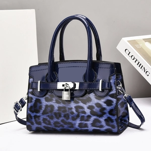Blue leopard print tote bag with silver padlock and glossy leather handles