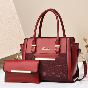 Two-piece reddish brown leather tote bag and wallet set with snakeskin embossed detail