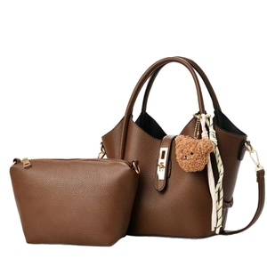 Brown lychee grain leather tote bag with gold twist lock and cute teddy bear charm