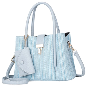 Elegant light blue woven handbag for women with matching mini charm and adjustable strap